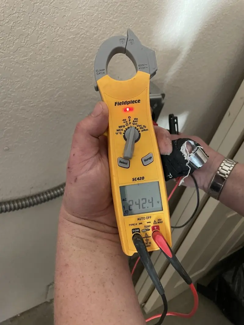 Voltage testing with clamp meter during Electrical Installation Services in Winona